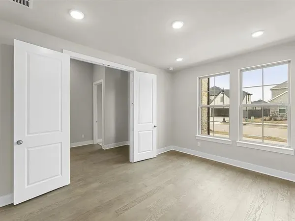 a view of an empty room with a window