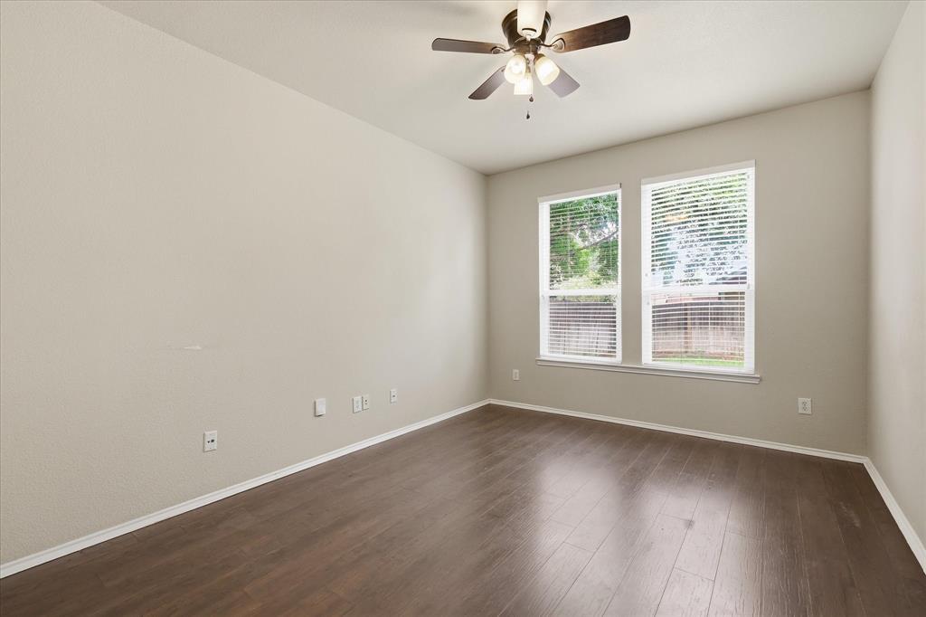 13236 Ridgepointe Road Fort Worth, TX 76244 - Photo 8 of 19 a view of an empty room with wooden floor and a window