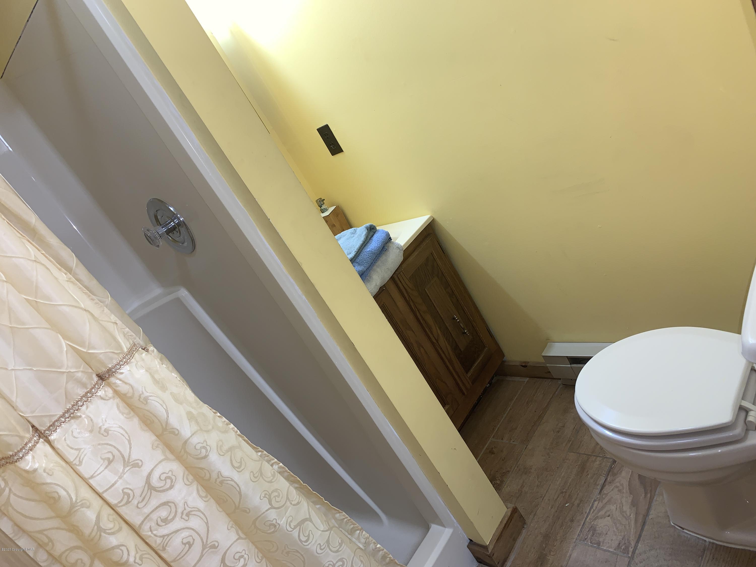 1108 Hampstead Road Bushkill, PA 18324 - Photo 27 of 34 a bathroom with a toilet and a shower