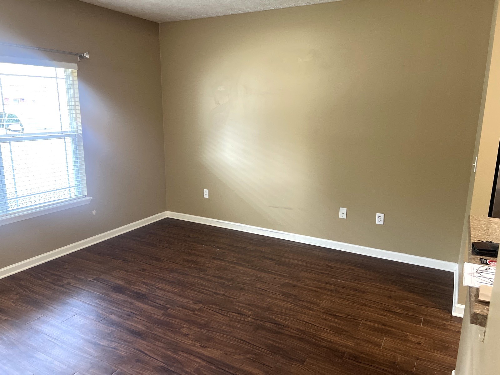 1000 Wells Way Spring Hill, TN 37174 - Photo 4 of 20 a view of an empty room with wooden floor and a window