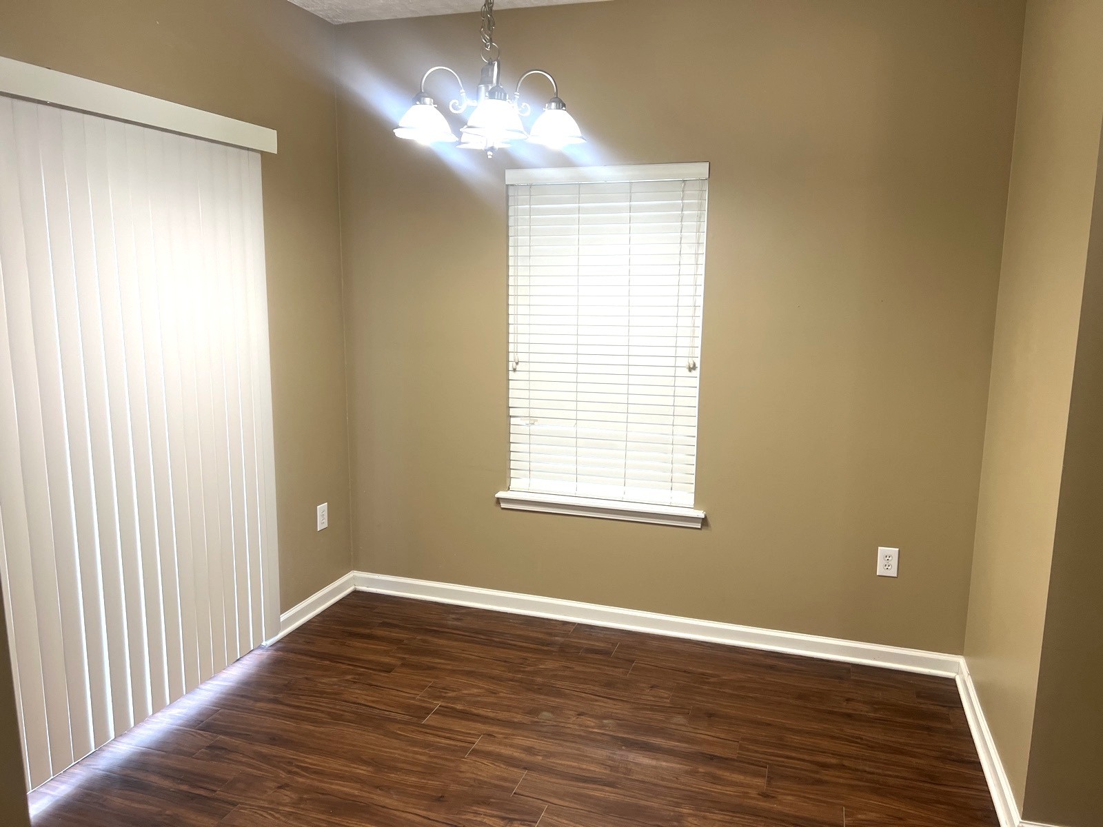 1000 Wells Way Spring Hill, TN 37174 - Photo 7 of 20 a view of an empty room with wooden floor and a window