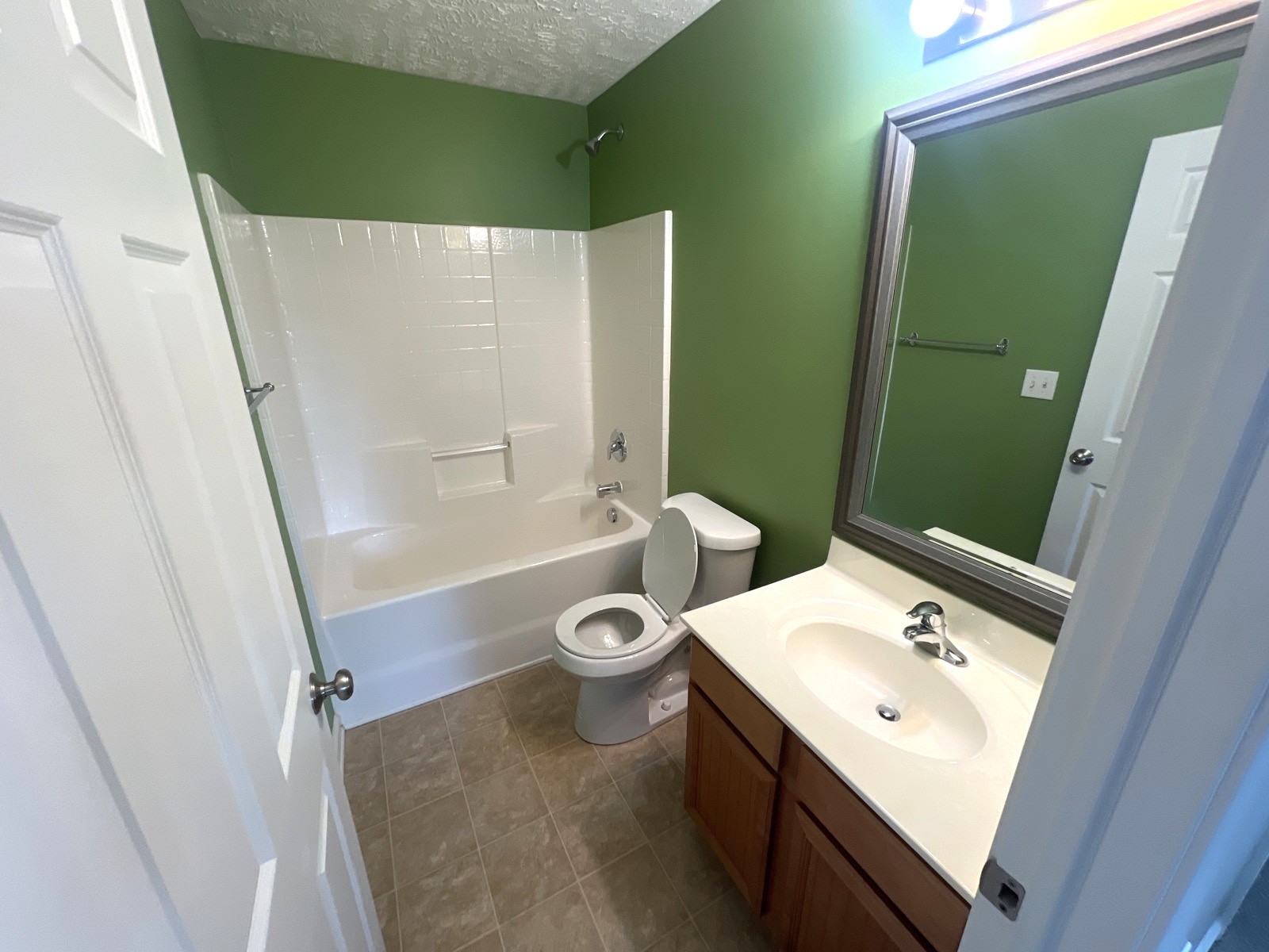 1000 Wells Way Spring Hill, TN 37174 - Photo 10 of 20 a bathroom with a sink and a mirror