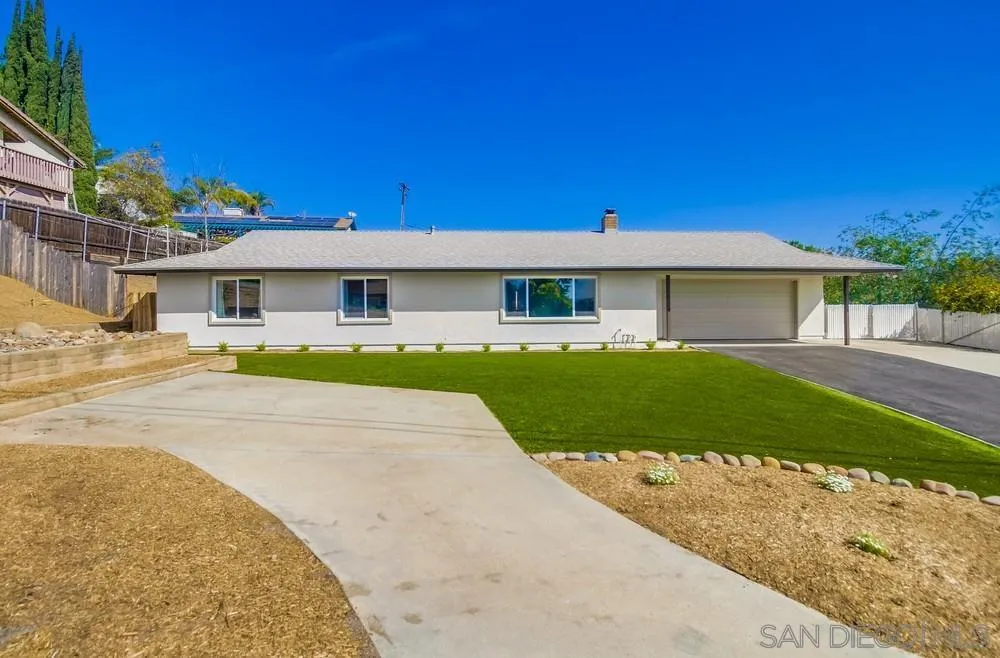 8174 Sunset Road Lakeside, CA 92040 - Photo 3 of 46 a front view of a house with a garden and yard