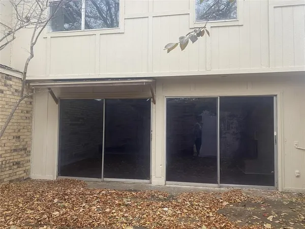 a spacious bathroom with a granite countertop sink and a mirror