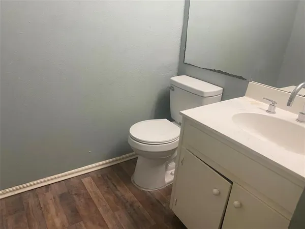 a kitchen with a refrigerator and a sink