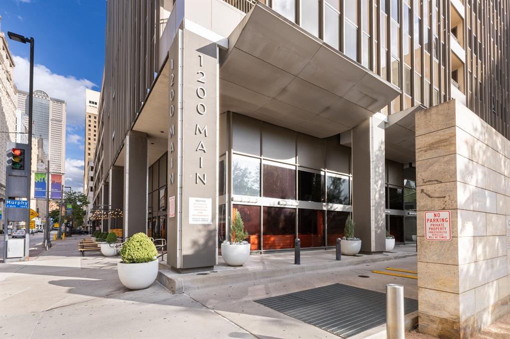 a view of a building with sitting area