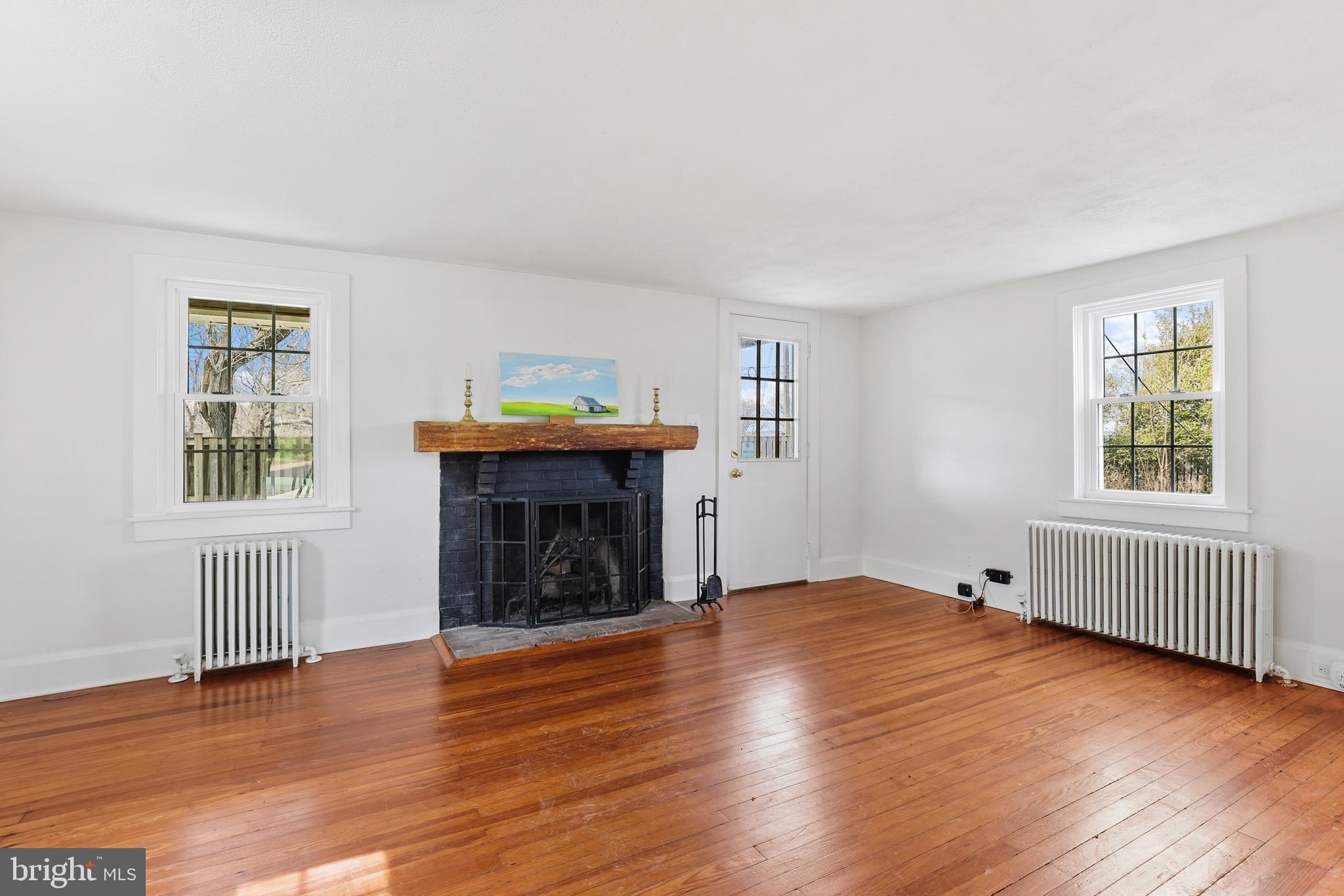 12525 Garrison Forest Road Owings Mills, MD 21117 - Photo 14 of 40 Living Room with door to second covered porch
