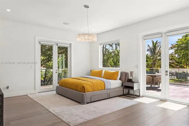 a spacious bedroom with a bed and a window