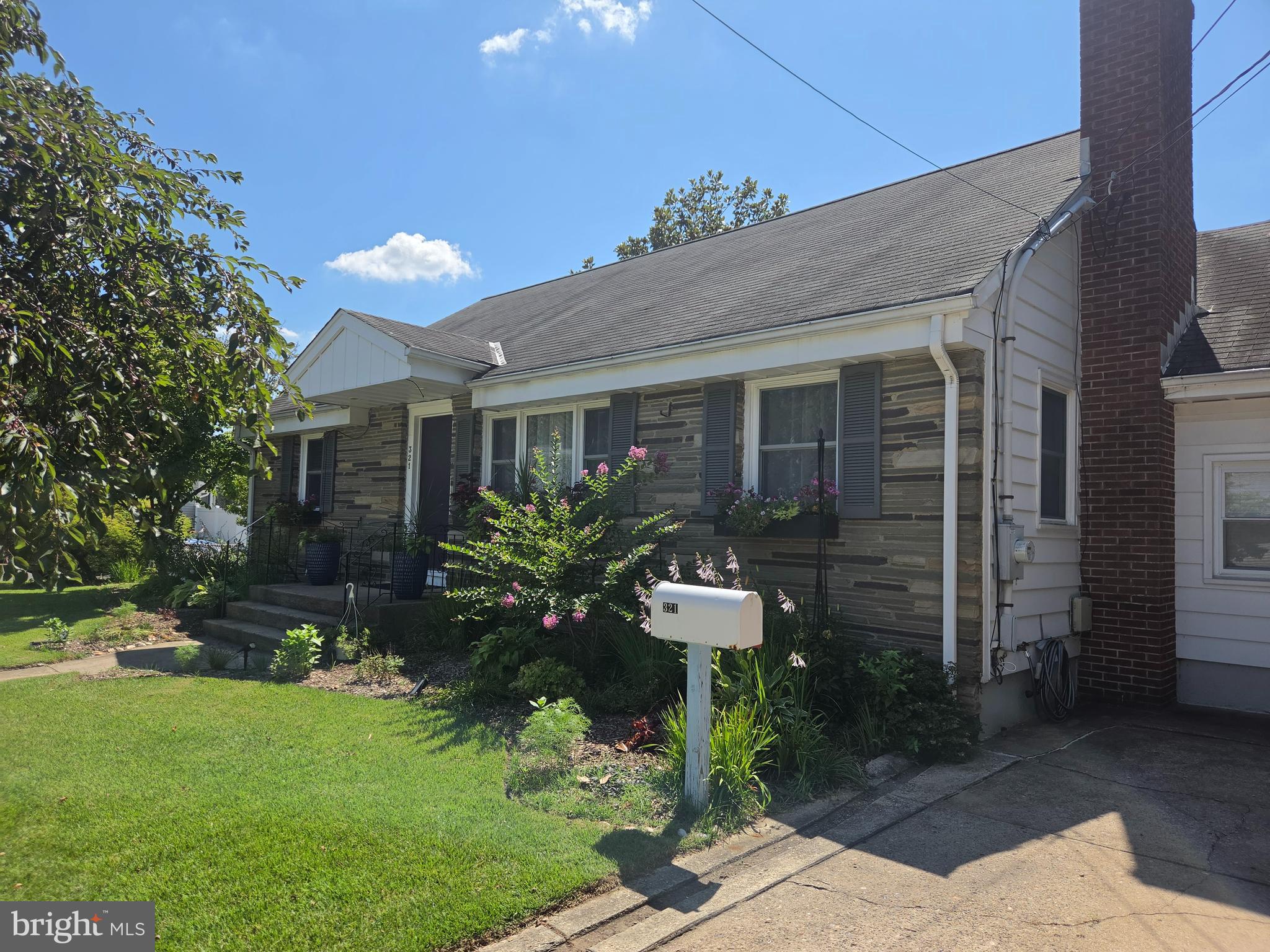 321 Buttonwood Street Hamilton, NJ 08619 - Photo 2 of 42 Exterior stone siding and window boxes adorn home