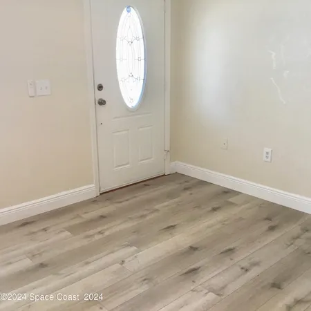 a view of a livingroom with a kitchen