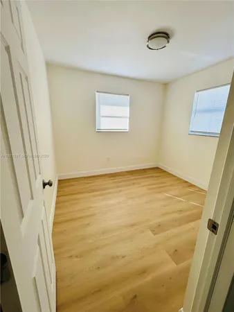 a bathroom with a toilet and a bath tub