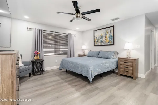 a bedroom with a bed and a table