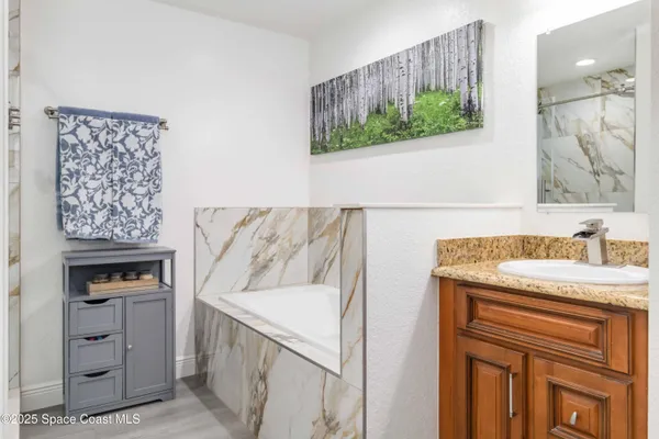 a view of storage and utility room with washer and dryer