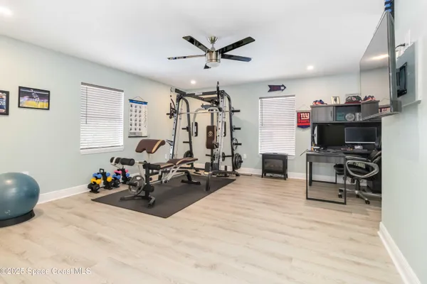 a living room with furniture a air conditioner vent and a window