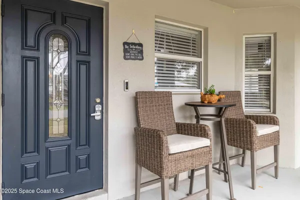 a dining room with furniture and windows