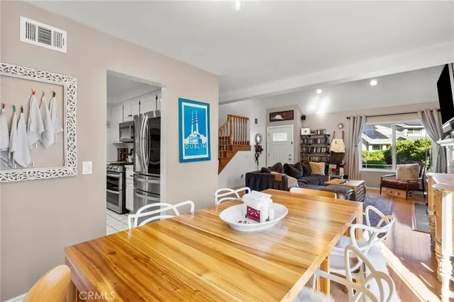 a bedroom with furniture and a wooden floor