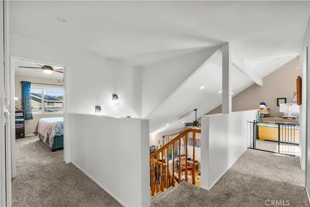 a view of a hallway with furniture and closet