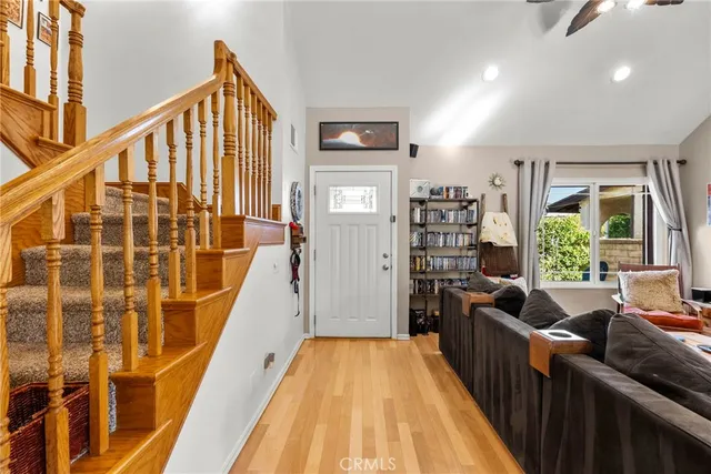 a view of livingroom with furniture entryway and windows