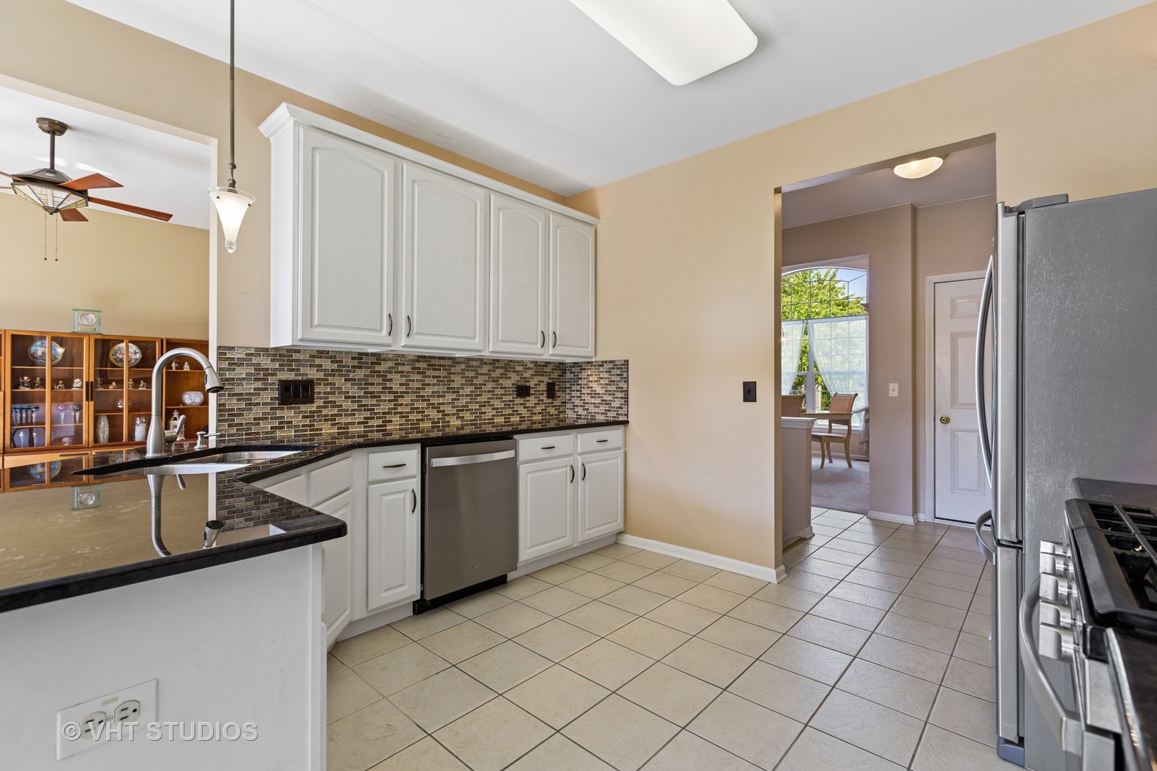 1920 Tyler Trail McHenry, IL 60051 - Photo 11 of 20 a kitchen with a sink stove and refrigerator