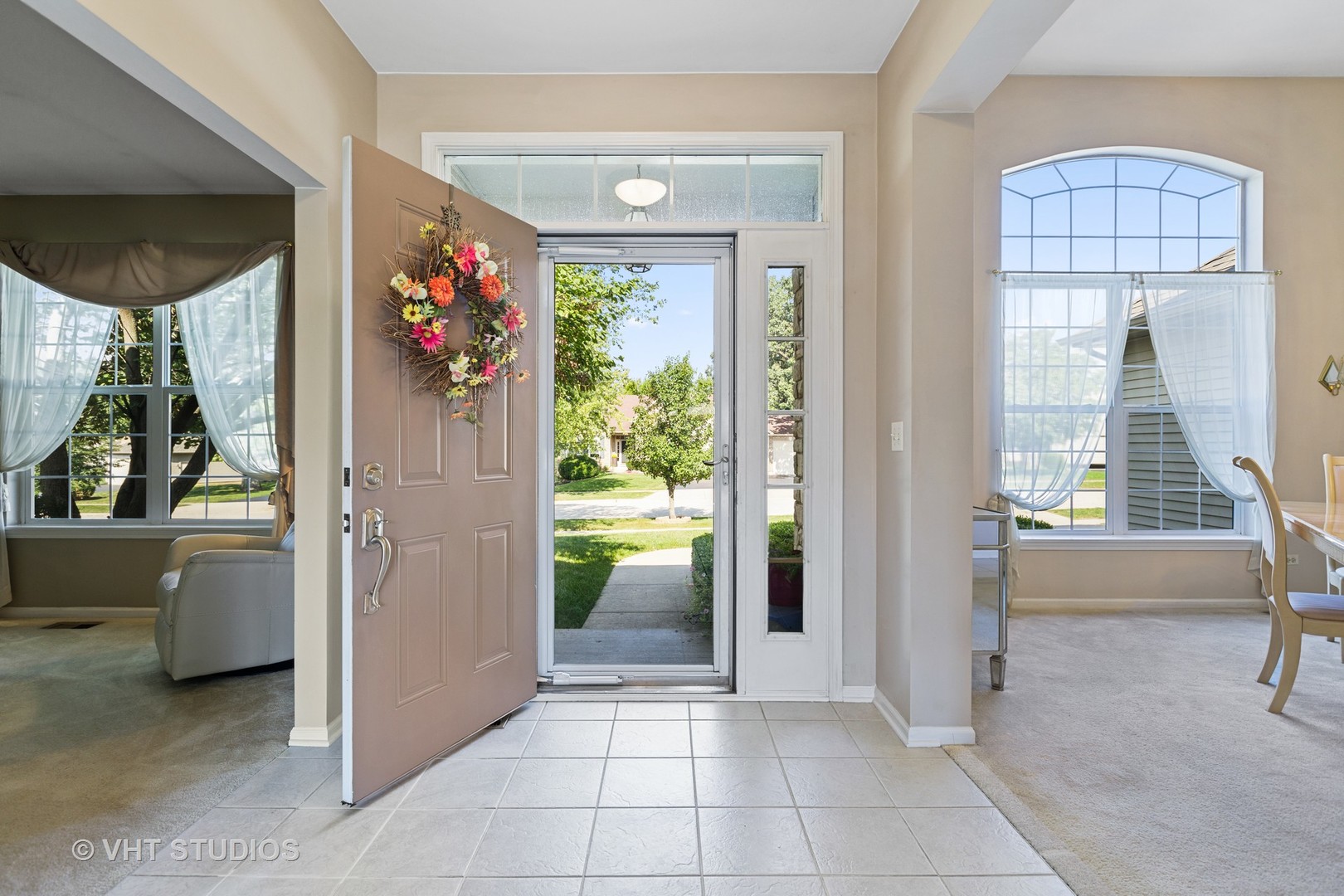 1920 Tyler Trail McHenry, IL 60051 - Photo 3 of 20 a view of an entryway and livingroom in right side
