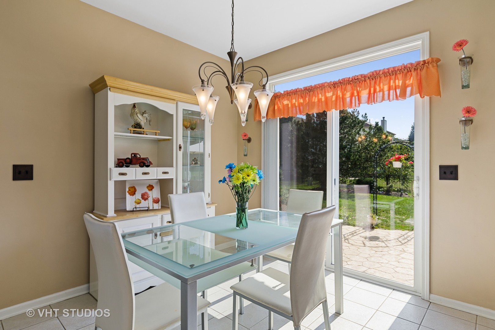 1920 Tyler Trail McHenry, IL 60051 - Photo 9 of 20 a dining room with furniture a chandelier and a large window