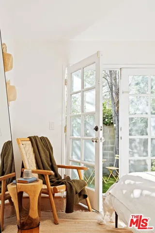 a view of workspace with wooden floor windows