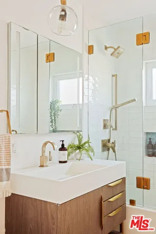 a bathroom with a sink and a mirror