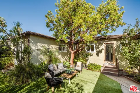 a backyard of a house with lots of green space