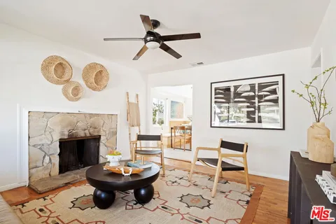 a living room with a couch and a fireplace
