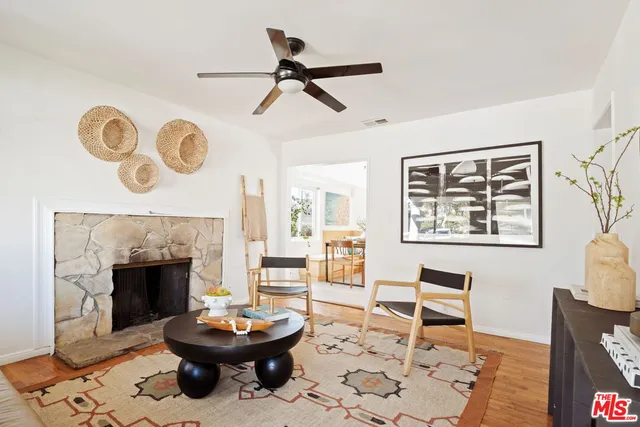 a living room with a couch and a fireplace