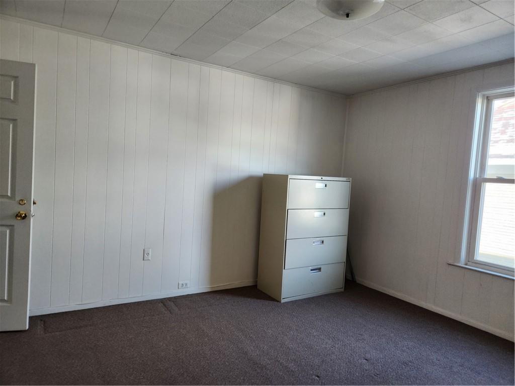 218 West Main Street Ligonier, PA 15658 - Photo 9 of 14 an empty room with a window and cabinet