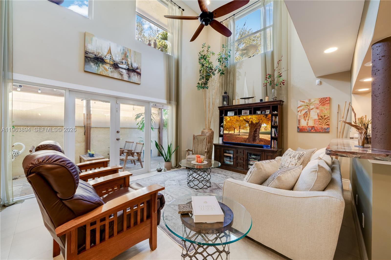 3197 Virginia Street Miami, FL 33133 - Photo 6 of 22 a living room with furniture and a flat screen tv