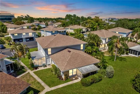 an aerial view of a house with garden space and street view