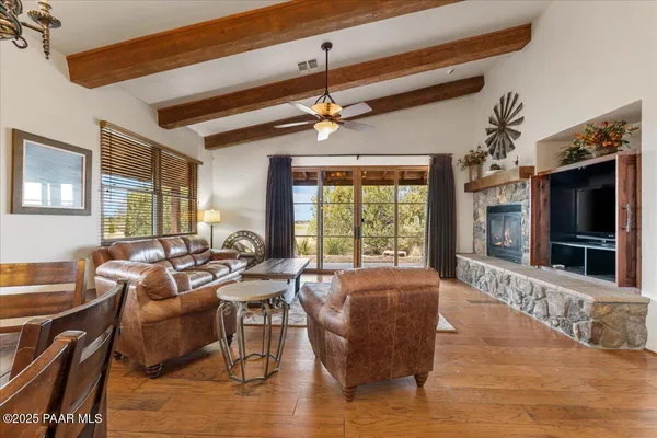 a living room with lots of furniture and a rug