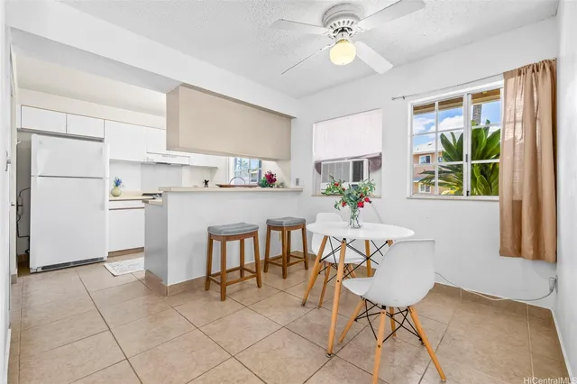 a view of kitchen with cabinets and outdoor seating