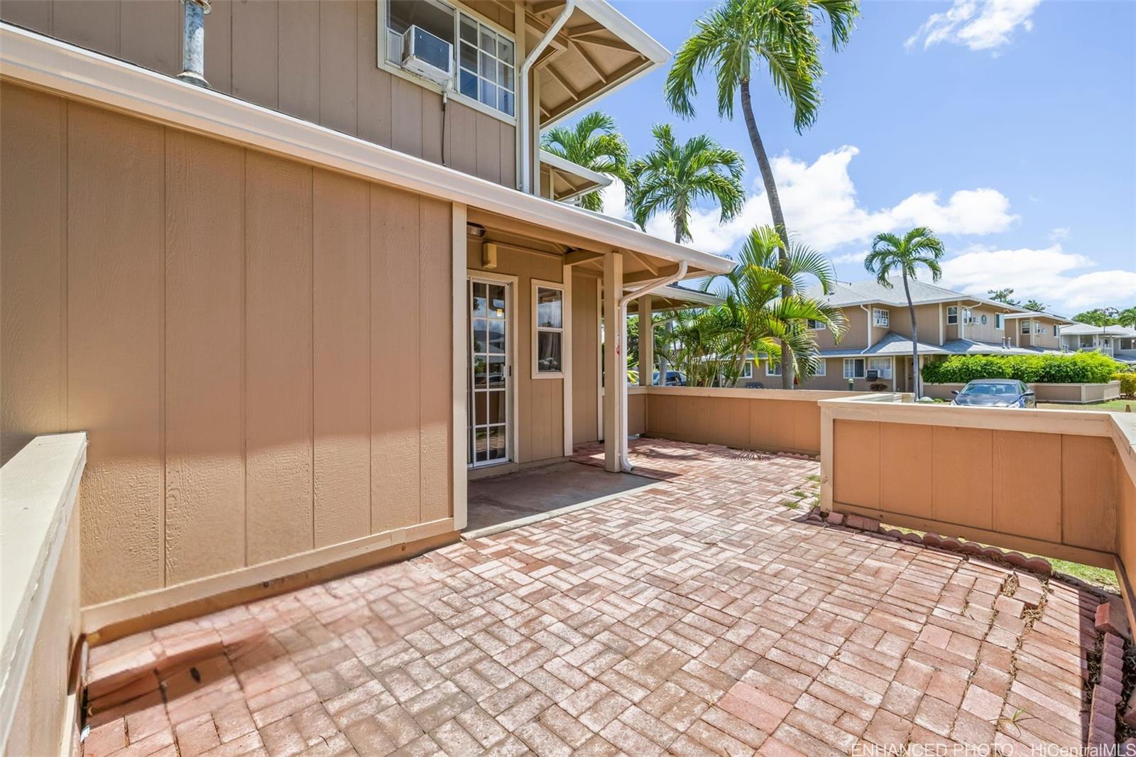 91-1008 Makaaloa Street, Unit 3E Ewa Beach, HI 96706 - Photo 5 of 21 a view of a entrance gate of the house