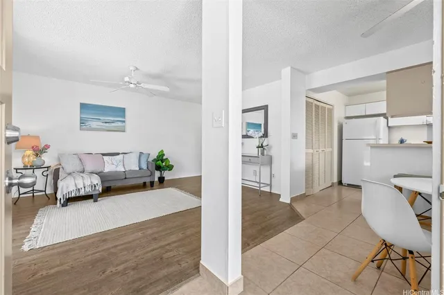 a living room with furniture and a rug