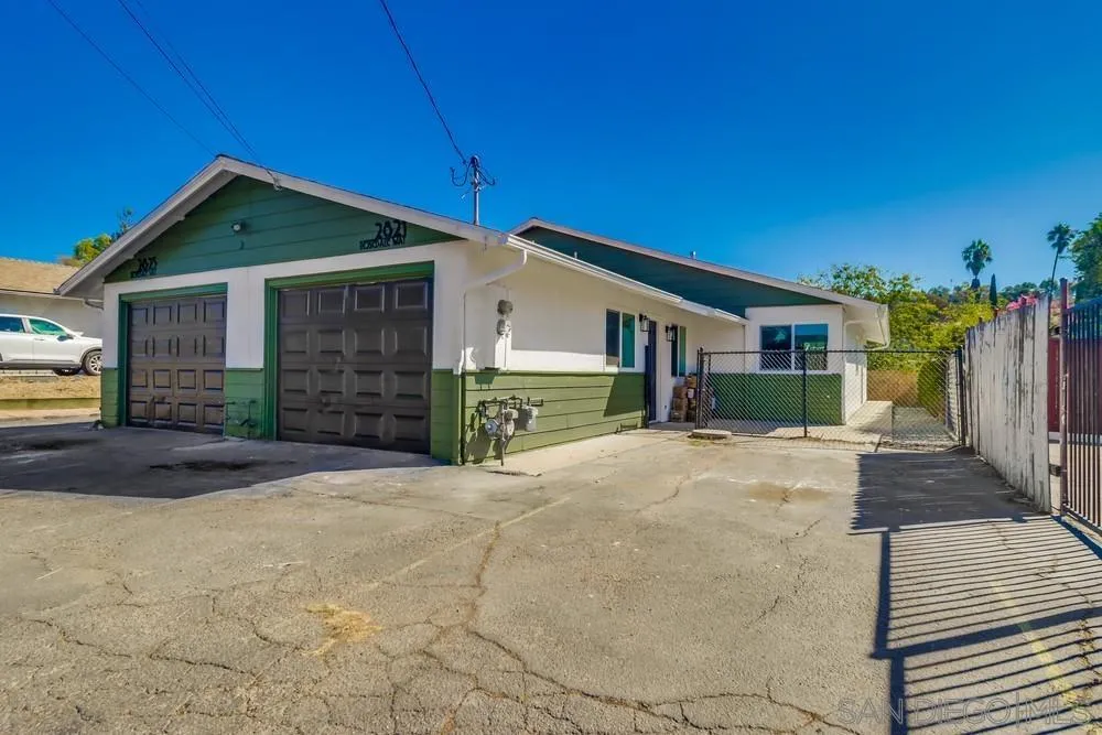 2821-25 Rosedale Way Spring Valley, CA 91977 - Photo 2 of 72 a front view of a house with a yard and garage