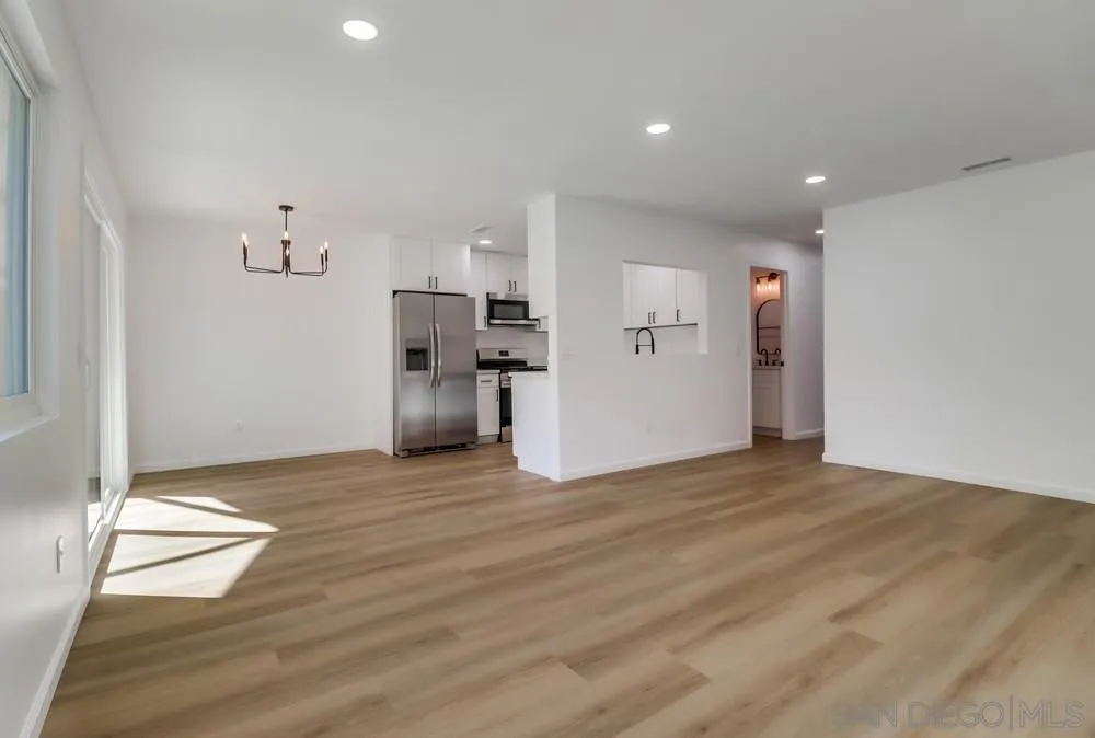 2821-25 Rosedale Way Spring Valley, CA 91977 - Photo 38 of 72 a view of empty room with wooden floor