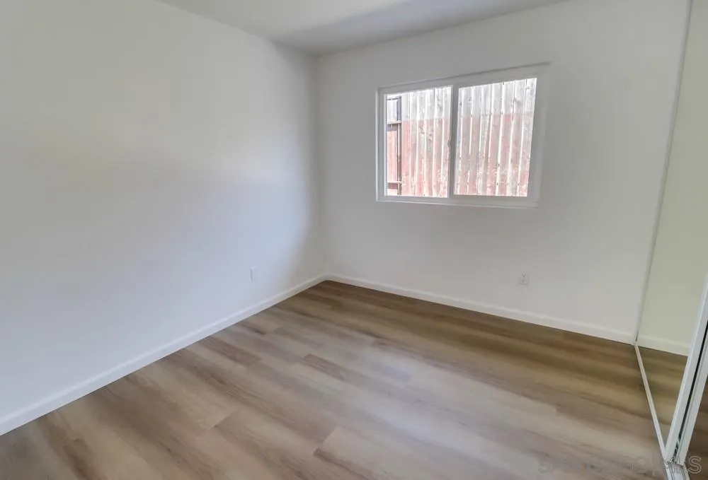 2821-25 Rosedale Way Spring Valley, CA 91977 - Photo 39 of 72 wooden floor in an empty room with a window