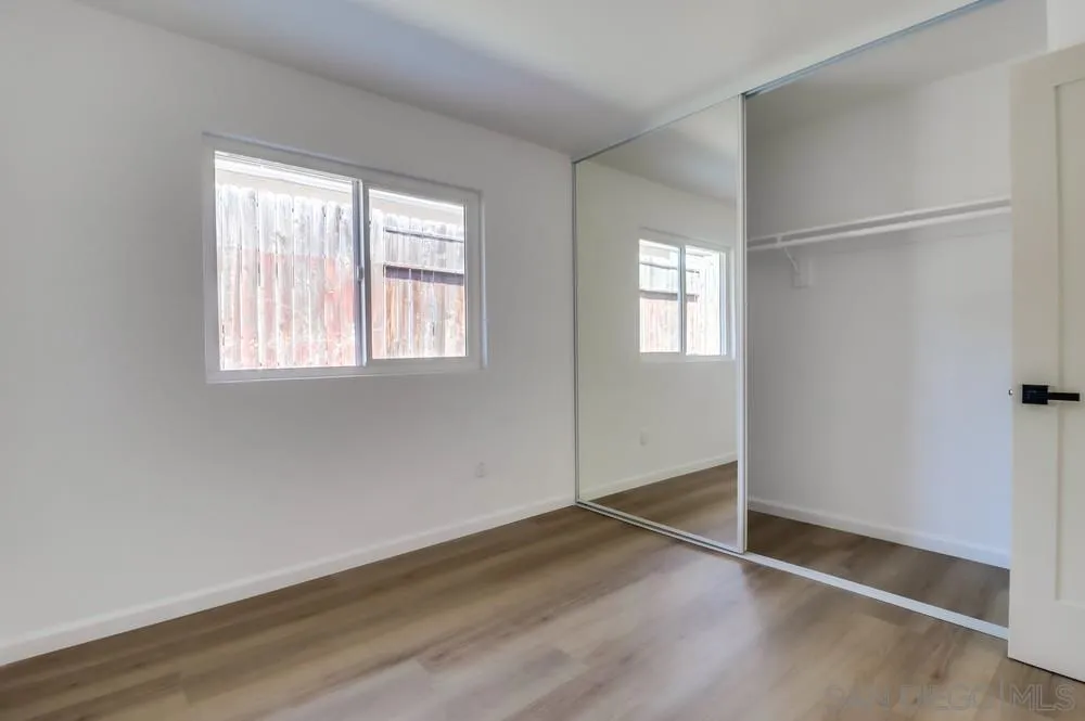 2821-25 Rosedale Way Spring Valley, CA 91977 - Photo 40 of 72 an empty room with wooden floor and windows