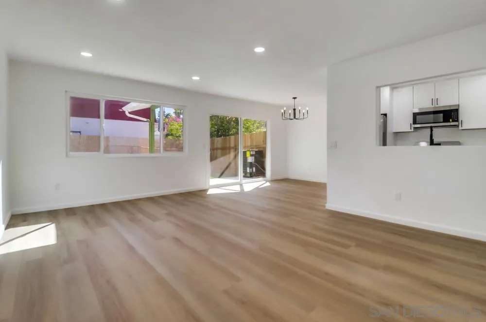 2821-25 Rosedale Way Spring Valley, CA 91977 - Photo 47 of 72 an empty room with wooden floor and windows