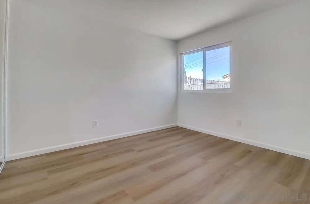2821-25 Rosedale Way Spring Valley, CA 91977 - Photo 64 of 72 an empty room with wooden floor and windows