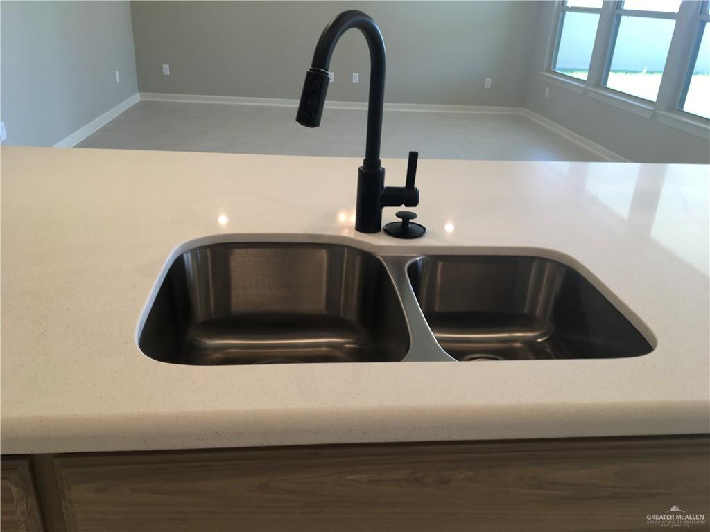 14119 Mylie Way McAllen, TX 78504 - Photo 20 of 29 a close view of a sink and granite counter top