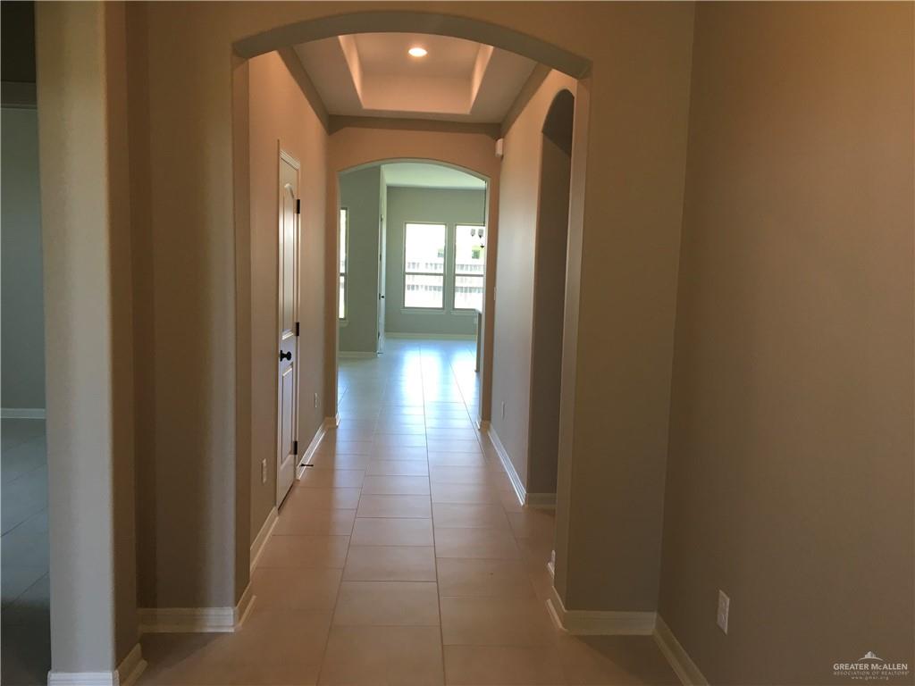 14119 Mylie Way McAllen, TX 78504 - Photo 2 of 29 a view of a hallway with wooden floor and closet