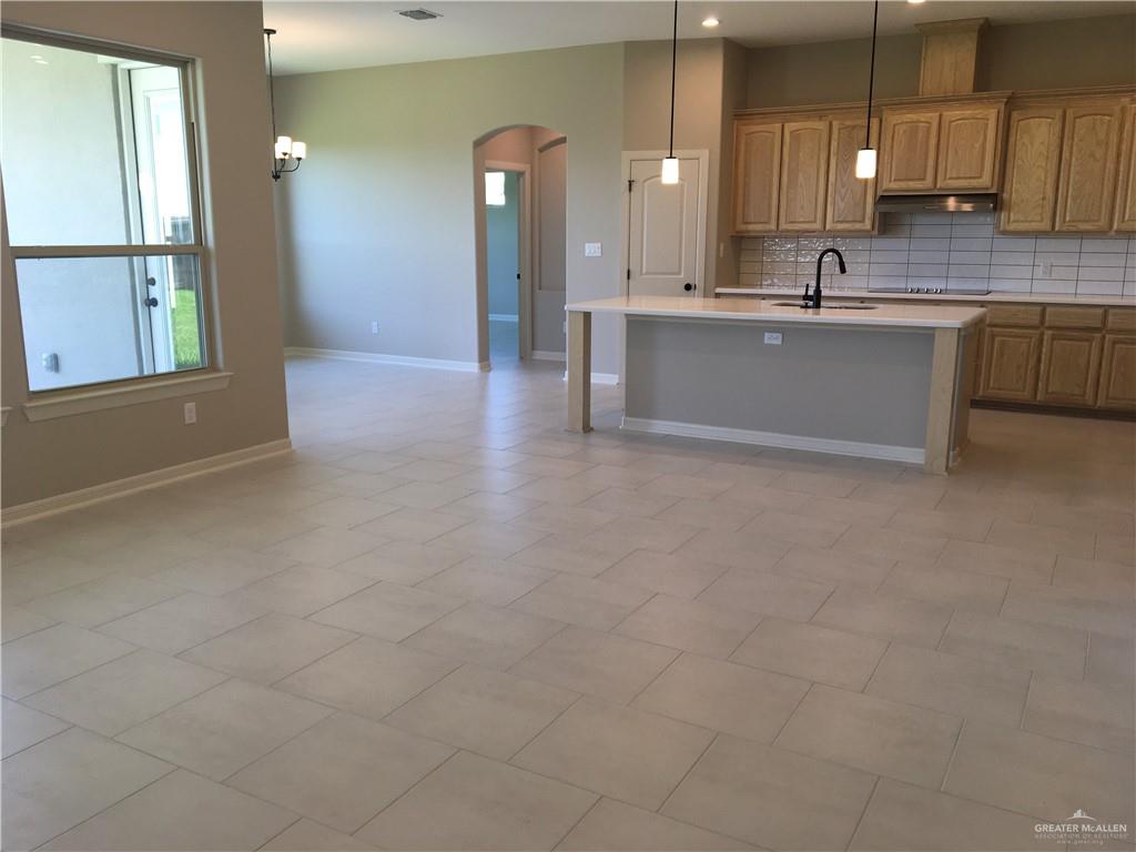 14119 Mylie Way McAllen, TX 78504 - Photo 22 of 29 a large kitchen with kitchen island a sink stainless steel appliances and cabinets