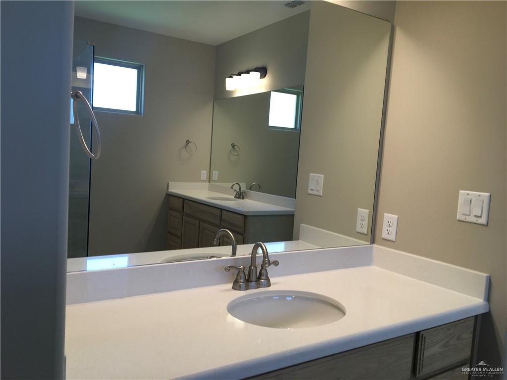 14119 Mylie Way McAllen, TX 78504 - Photo 25 of 29 a bathroom with a sink and a mirror