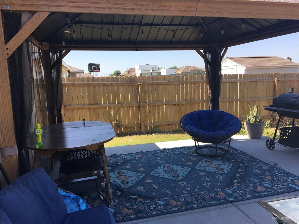 14119 Mylie Way McAllen, TX 78504 - Photo 8 of 29 a view of a swimming pool with a chairs and table in the patio