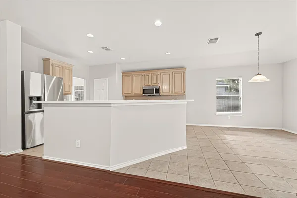a kitchen with a sink and stove