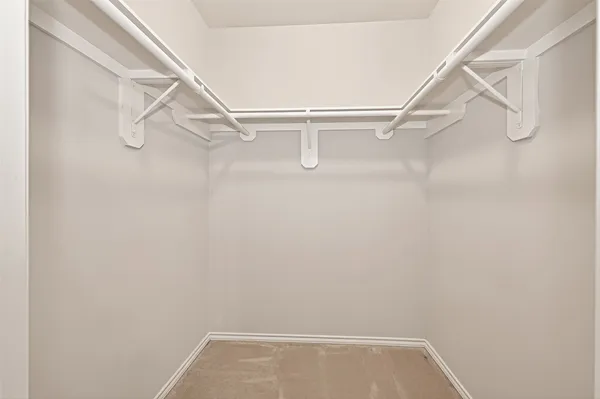 a view of an empty walk in closet